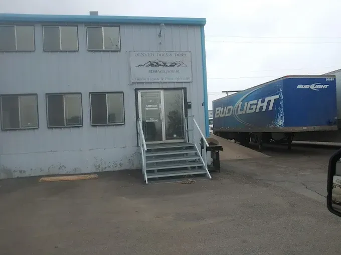 Denver Truck & Trailer office building on Newport Street with a Bud Light trailer parked beside it